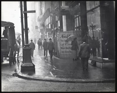 Pedestrians Walking on Washington Avenue in the Rain by William G. Swekosky
